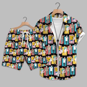 May include: A matching shirt and shorts set. The black background is covered with a colorful pattern of figures in various poses, set against vertical blocks of yellow, pink, blue, and teal. The shirt has short sleeves and a collar, and the shorts have a drawstring.