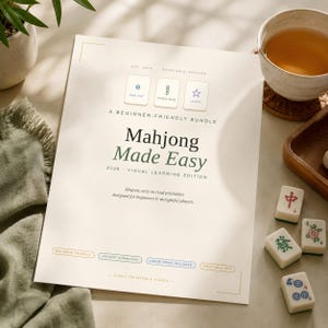 May include: A printed guide titled "Mahjong Made Easy" is displayed, with the text "A Beginner-Friendly Bundle". The image includes mahjong tiles, a cup of tea, and a small plant. The guide also has the text "Instant Download" and "Printable PDF".