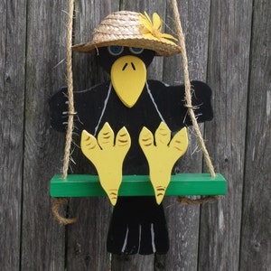 Swinging crow   Crow on swing