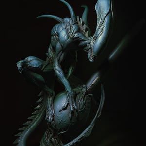 May include: A teal-coloured alien creature sculpture with a long tail, sharp claws, and a large head crest. The creature is posed on a spherical base, against a dark background. The sculpture has a textured surface and is lit to highlight its features.