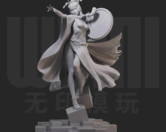May include: A grey figurine of a woman in a flowing gown, holding a shield and wearing a crown. The figure is standing on a geometric base, with one arm outstretched. The image has a dark background.