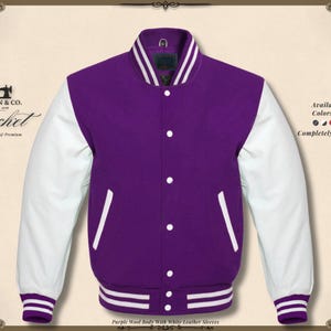 May include: A purple wool body varsity jacket with white leather sleeves. The jacket has a button-up front, white accents, and a striped collar and cuffs. The jacket is customizable and available in various colors and sizes.