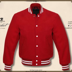 May include: A red varsity jacket with white detailing on the collar, cuffs, and waistband. The jacket features white buttons and a black lining. The text "KHAN & CO. Jacket Handmade & Premium" is visible. The jacket is completely customizable.
