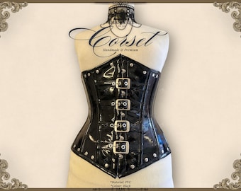 May include: Black PVC corset with silver-tone buckles and rivets. The corset is displayed on a mannequin and features a structured design. The word "Corset" is written in script above the corset.