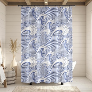 May include: Blue and white patterned shower curtain featuring a repeating wave design. The curtain is made of a durable material and is designed to fit standard shower sizes. The wave pattern adds a nautical theme to any bathroom.