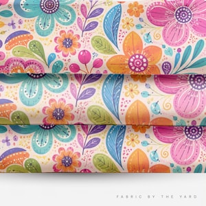 May include: A fabric featuring a repeating pattern of stylized flowers and leaves in shades of pink, orange, teal, purple, and green on a light cream background. The design includes small dots and thin lines, with the text FABRIC BY THE YARD at the bottom.