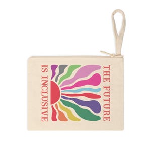 May include: A cream-coloured zippered pouch with the text "THE FUTURE IS INCLUSIVE" in red. The pouch features a colourful sunburst design with rainbow-coloured wavy lines. A cream-coloured loop is attached to the zipper.