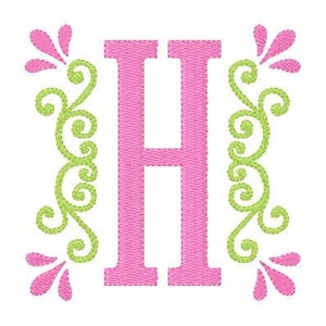 May include: Pink letter H with green floral embellishments on each side.