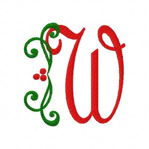 May include: A red letter W with a green leafy design and red berries. The letter is in a cursive font.