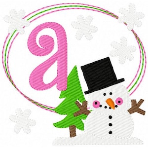 May include: Pink letter A with a green Christmas tree and a snowman wearing a black top hat in a white circle with a pink and green border.  Snowflakes are scattered around the circle.