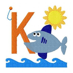 May include: Orange letter K with a blue fish swimming next to it. The fish has a yellow sun above it and is swimming in blue waves.