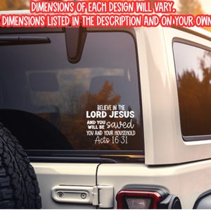May include: White decal applied to a car window. The decal reads "BELIEVE IN THE LORD JESUS" with the scripture reference Acts 16:31. The text "DIMENSIONS OF EACH DESIGN WILL VARY" is also visible.