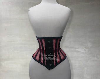Könnte beinhalten: Ein schwarzes und rotes Mesh-Korsett mit Frontverschluss und einem roten Mesh-Panel auf der Vorderseite. Das Korsett befindet sich auf einer weißen Schaufensterpuppe.