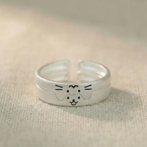 May include: A rustic wooden sign with the text "Welcome to our home" in white lettering. The sign features a distressed finish and a simple, inviting design, perfect for front door decor.