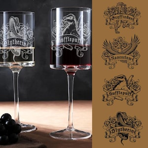 May include: Two clear wine glasses with etched designs, one filled with white wine and the other with red wine. The glasses feature the Slytherin and Hufflepuff crests. Additional crests for Gryffindor and Ravenclaw are also shown.