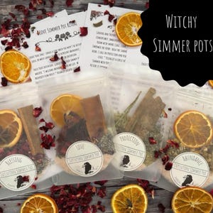 May include: A selection of 'Witchy Simmer Pots' featuring dried orange slices, cinnamon sticks, and herbs in clear pouches. Each pouch is labelled with intentions such as 'Love', 'Blessing', and 'Abundance'. The image includes text that reads 'Love Simmer Pot Ritual'.
