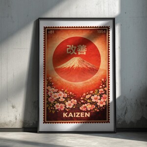 May include: Framed poster with a vintage design. The artwork features a red circle with Japanese characters and a mountain illustration. Cherry blossoms frame the bottom, with the word "KAIZEN" below. The poster has a stamp-like border and the numbers "+81" and "1954".
