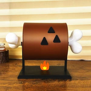 Porta-lenços artesanal em formato de rolinho de carne de churrasco, impresso em 3D, com design divertido de coxa de frango assada. Organizador fofo para cozinha ou mesa. Ideal para gamers.