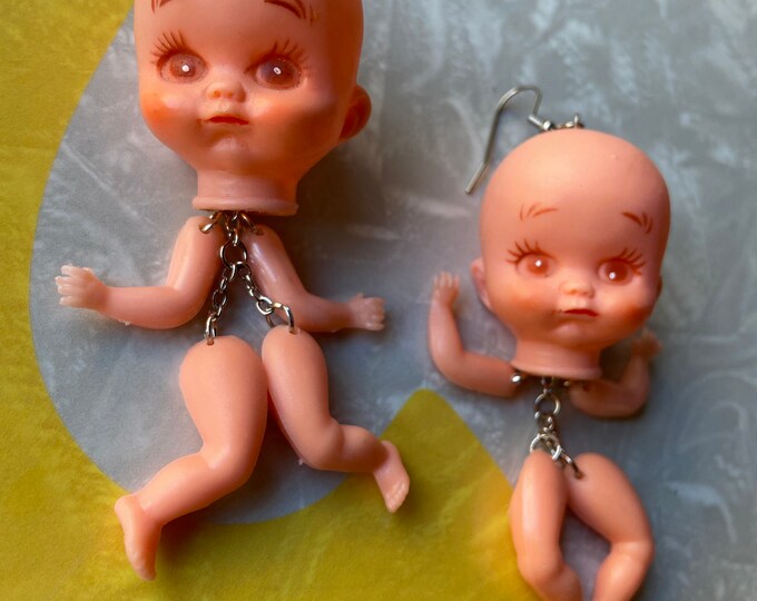 Anxious baby has just gotta dance Weird earrings for weird times. Earrings