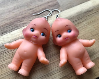 Kewpie doll earrings.
