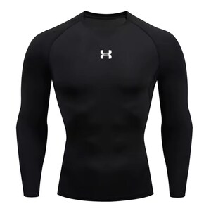 May include: Black long-sleeve compression shirt with a crew neck. The shirt features a white logo on the chest. The athletic top is designed for a snug fit and is made of a stretchy, performance fabric.