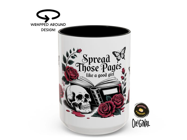 May include: White ceramic mug with a black interior, featuring a design with a skull, roses, and the text "Spread Those Pages like a good girl." A butterfly graphic is also included. The mug has a wrapped-around design.