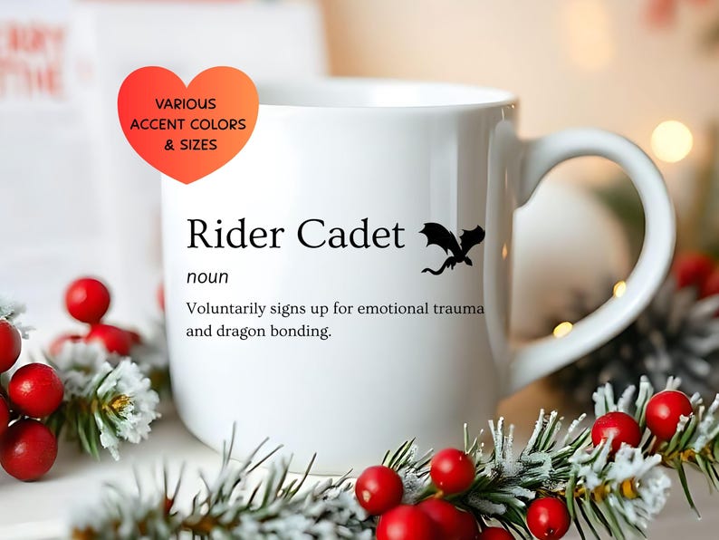 May include: White ceramic mug with the text "Rider Cadet" and a black dragon silhouette. The mug also features the definition of "Rider Cadet". A heart-shaped graphic indicates various accent colors and sizes.