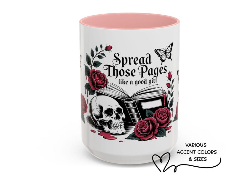 May include: White ceramic mug with a pink interior, featuring a skull, roses, and the text "Spread Those Pages like a good girl." A butterfly and book illustrations complete the design. Available in various accent colors and sizes.