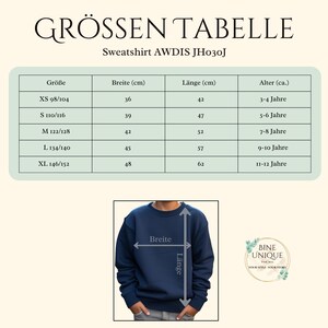 May include: A size chart for the AWDIS JH030J sweatshirt, featuring a table with columns for size, width in cm, length in cm, and age. Below, a navy blue sweatshirt shows arrows indicating where width and length measurements are taken.