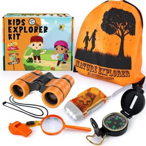 May include: A Kids Explorer Kit with orange binoculars, a compass, a flashlight, a magnifying glass, and a whistle. The kit includes an orange drawstring bag with a tree and people silhouette. The box features illustrations of children.