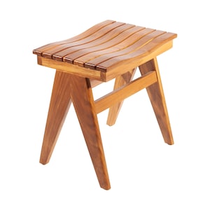 May include: A wooden stool with a curved, slatted seat and a simple, A-frame base. The stool is made of natural wood with a light brown finish.