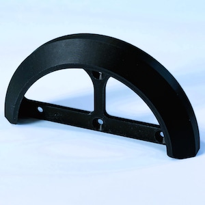 May include: Black plastic fender with a curved shape and a metal frame with four holes.