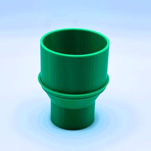 May include: A green plastic funnel with a wide top and a narrow bottom. The funnel has a smooth, rounded surface.