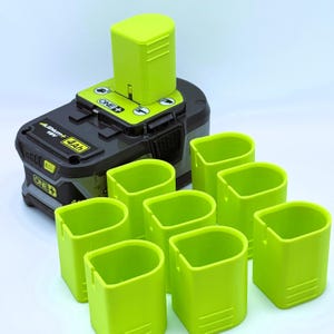 May include: A black and green 18V Lithium+ 4Ah battery with a lime green battery holder and eight lime green battery holders. The battery has the "ONE+" logo.