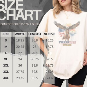 May include: Cream Comfort Colors 1717 T-shirt with an eagle, horse, and American flag design. The word "Freedom" is printed below. A size chart is visible, with measurements in inches: width, length, and sleeve.