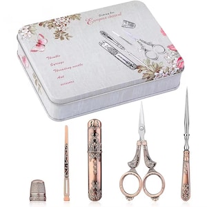 May include: A vintage-style sewing box with a floral design and the text "Sewing box European classical." The box contains a thimble, syringe, threading needle, awl, and scissors. Additional sewing tools are displayed next to the box.