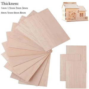 May include: A collection of light-colored wooden craft sheets in various thicknesses, ranging from 1mm to 8mm. The image also shows a small, assembled wooden house model, suggesting a crafting or DIY theme.