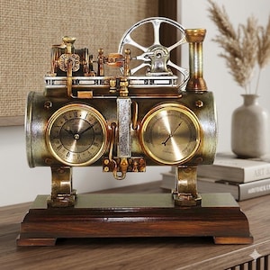 May include: A steampunk-style clock with a metallic finish. The clock features two circular dials, one with Roman numerals and the other with a gauge. A large silver wheel and various pipes and gears complete the design. The clock sits on a dark wooden base.