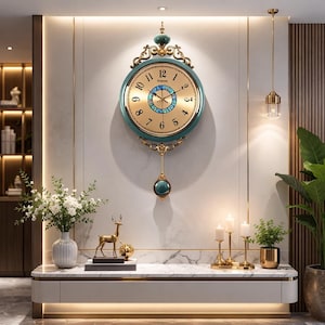 May include: A large, ornate wall clock with a teal and gold color scheme. The clock features Roman numerals, decorative gold accents, and a pendulum. The clock is mounted on a light-colored wall, with decorative elements and plants in the foreground.