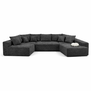 K&ouml;nnte beinhalten: Ein gro&szlig;es, dunkelgraues Ecksofa mit Cordstruktur. Das Sofa hat eine U-Form mit mehreren Kissen und Zierkissen. Ein passender Hocker ist enthalten, und ein kleiner wei&szlig;er Dekorationsgegenstand liegt auf dem Hocker.
