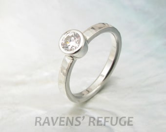 handmade diamond bezel engagement ring with waterfall hammering