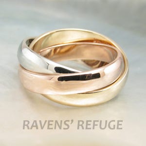 Tricolor rolling rings in 14k gold interlocking bands of three colors in rose gold, yellow gold and white gold image 1