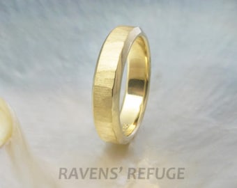 May include: A gold wedding band with a hammered finish. The band is slightly angled and has a polished edge.