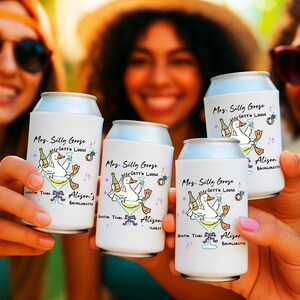 May include: White can coolers with a cartoon goose design, martini glass, and text. The text reads "Mrs. Silly Goose, Gett'n Loose, Austin Texas, Alison's Bachelorette". The design includes a bottle, ring, and martini glass.