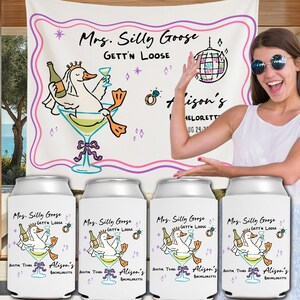 May include: White can coolers with a cartoon goose in a martini glass, with text that reads "Mrs. Silly Goose Gett'n Loose". A matching backdrop is visible behind the coolers. The backdrop has the same goose graphic and text.