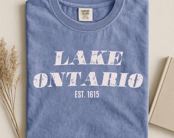 Lake Ontario Comfort Colors® shirt, hernoemd naar Lake America Tee. Politiek T-shirt voor de Grote Meren in 2026, voor Canada en de VS.