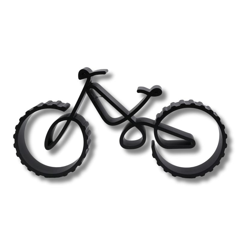 Hollow geometric bicycle sculpture with thick ridged wheels, displayed on a white background. Viewed from above at a slight angle, showcasing smooth contours and visible layering texture along the frame and wheels.