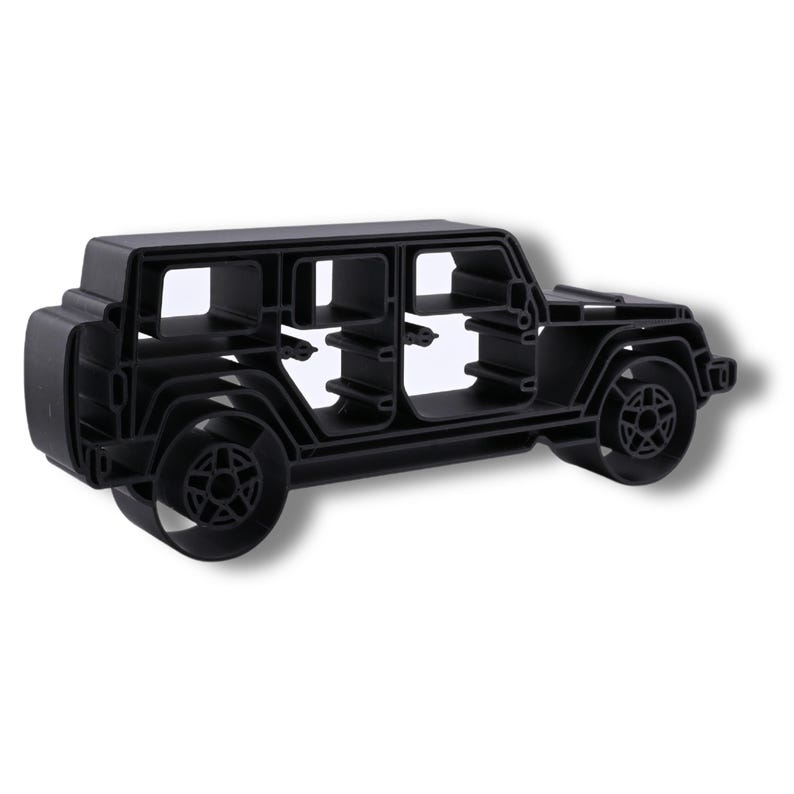 Three-quarter view of Black Jeep Wrangler 4 Door Side View, showing its open-line design and physical depth.