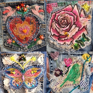 May include: Four blue denim pockets decorated with mixed media art. One features a red heart with birds, another a large pink rose with a bee, the third a butterfly with lace, and the fourth a green bird with fabric scraps and embroidery.