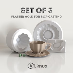May include: A set of three plaster molds for slip casting, including a teacup, saucer, and two mold halves. The teacup and saucer are beige, while the molds are white. The text "SET OF 3" and "PLASTER MOLD FOR SLIP CASTING" are displayed.